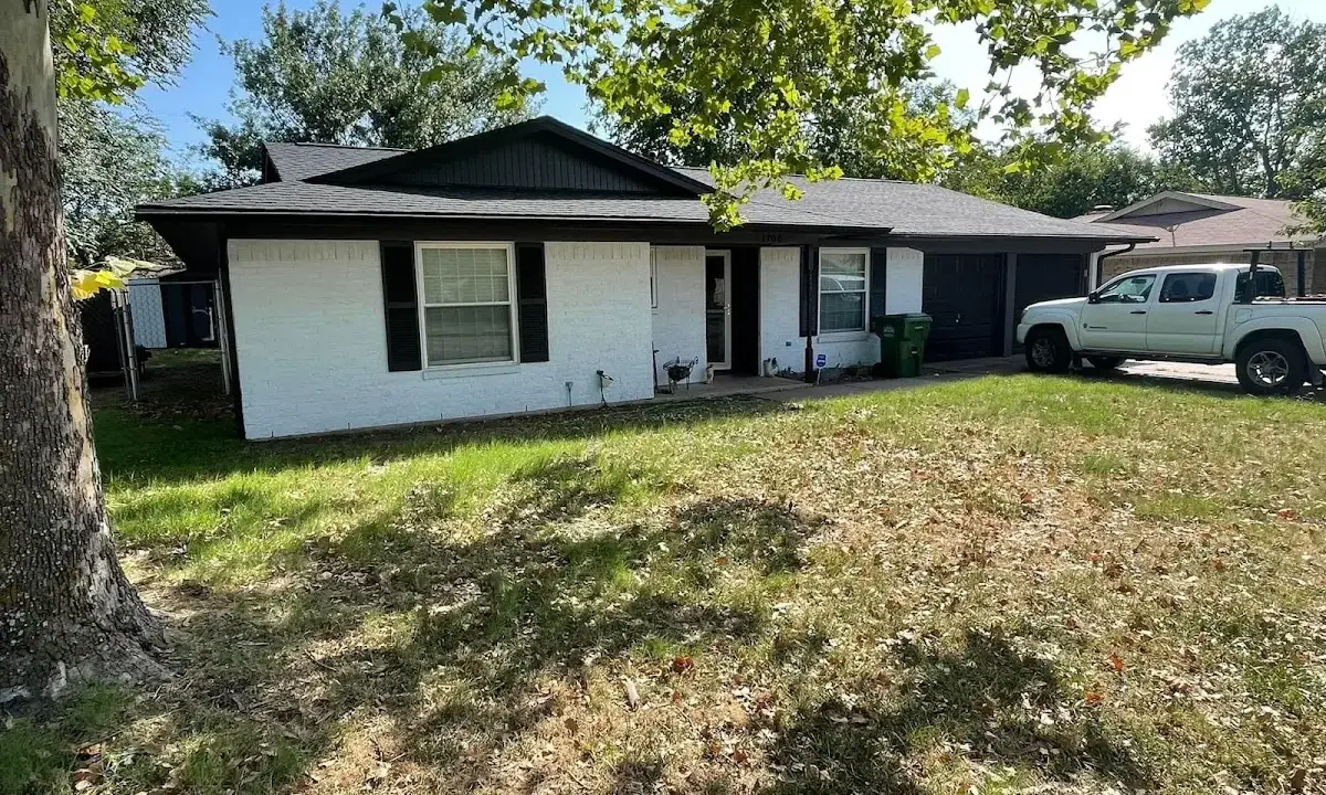 Professional roofing crew working on a residential roof in New Franklin